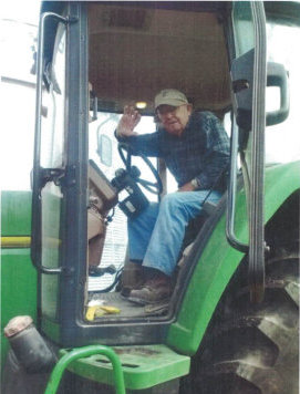 Picture of Charles Walker on his tractor.